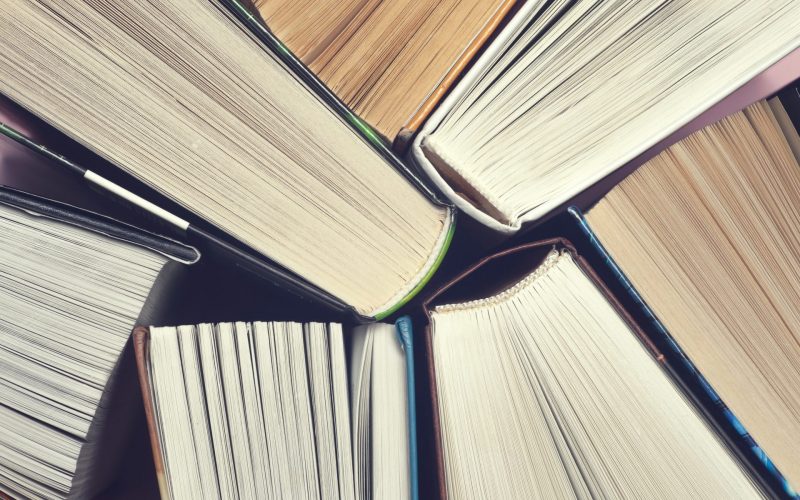 Set of books in the library. Knowledge, Science. Toned image.